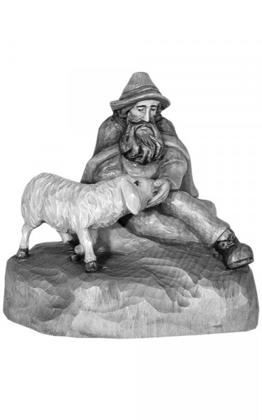 Shepherd sitting with sheep